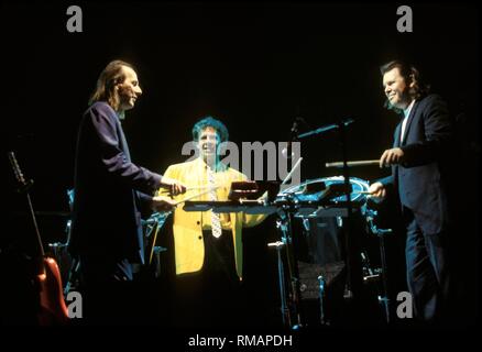 Guitarist Arian Belew and the percussionists of King Crimson are shown performing on stage during a 'live' concert appearance. Stock Photo