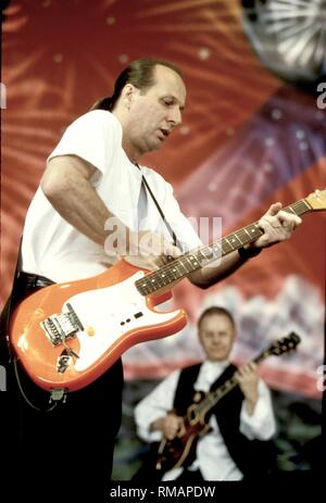 Guitarist Arian Belew of the progressive rock band King Crimson is shown performing on stage during a 'live' concert appearance. Stock Photo