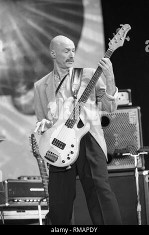 Bassist Tony Levin of the progressive rock band King Crimson is shown performing on stage during a 'live' concert appearance. Stock Photo