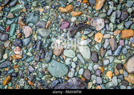 Rounded pebbles of different colours deposited on the bank of River Lidder in Kashmir Stock Photo