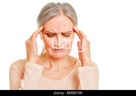 Old woman with a headache holds her hands to her temples Stock Photo