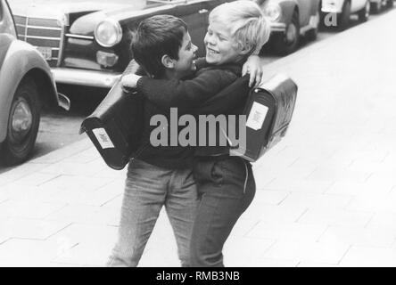 Two boys tussle a bit on the way to school. Stock Photo