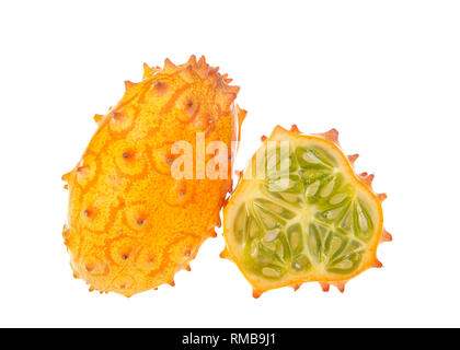 Kiwano fruit, also known as Cucumis metuliferus, horned melon, or African horned cucumber Isolated on white. One whole and one sliced melon. Kiwano is Stock Photo