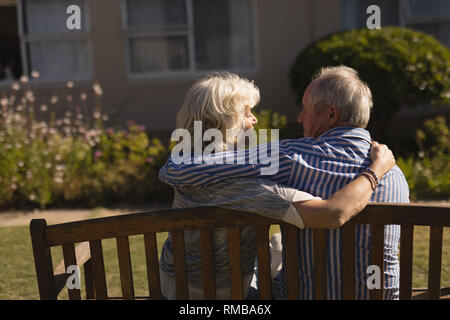 Senior couple embracing each other in the park Stock Photo