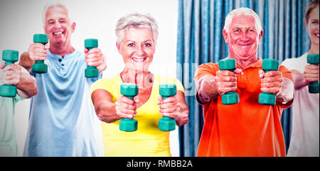 Portrait of seniors exercising with weights Stock Photo