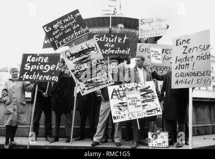 Students demonstrate in Munich on the occasion of the Spiegel affair. They carry banners with inscriptions like (English translation) 'A censorship does not take place! Constitution Article 5/1/3 'or 'Protect the Freedom of the Press'. Stock Photo