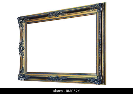 Ornamental wooden gold frame hanged on wood wall. Perspective view and isolated with clipping path Stock Photo