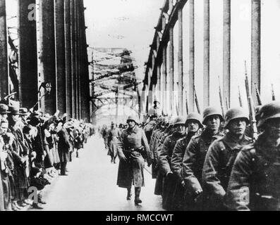 Marching Wehrmacht column on the bridge over the Rhine near Cologne. Stock Photo