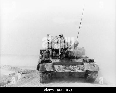 Iraqi soldiers are carrying a Soviet-style tank on their way to the front west of the Iraqi city of Amara. Stock Photo