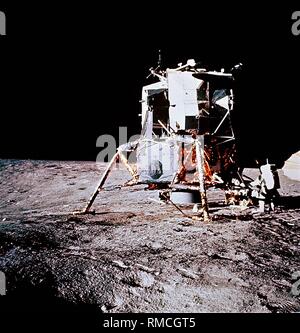 NASA Apollo 12 lunar landing mission astronaut Pete Conrad unfurls the ...