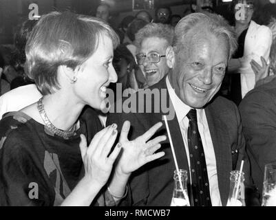 Party leader Willy Brandt (right) and his wife Brigitte Seebacher enjoy themselves at the party evening at the federal party convention of the SPD in Nuremberg. Stock Photo