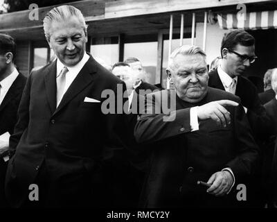 Federal Chancellor Kurt Georg Kiesinger gives a speech on the occasion of the 70th birthday of Ludwig Erhard (right). Stock Photo