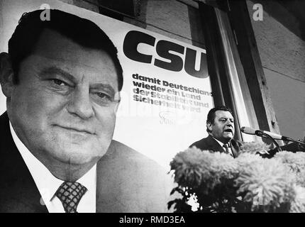 Franz Josef Strauss in a speech during the election campaign for the Bavarian state election of November 22, 1970. In the background the election poster of the CSU with the slogan: 'CSU - so that Germany again becomes a land of stability and security' and a portrait of Strauss. Stock Photo
