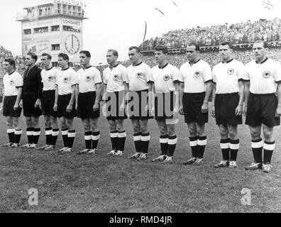 The players of the German national team on the soccer field of the Wankdorf Stadium of Bern shortly before the kickoff to the final of the World Cup, the Germans will win against Hungary with 3: 2. Stock Photo
