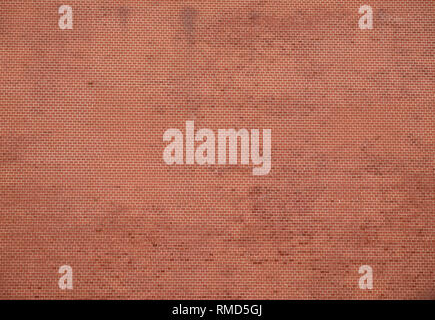 Wall from many small red bricks as background front view horizontal Stock Photo