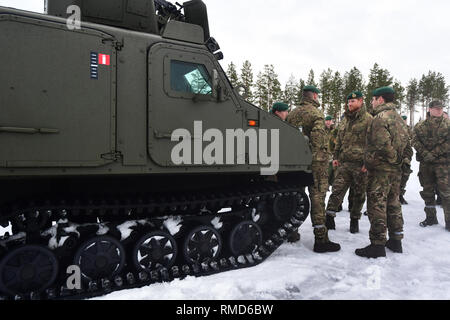 The Duke of Sussex talks to service personnel during a visit to Exercise Clockwork in Bardufoss, Norway, for a celebration of the 50th anniversary of the Commando Helicopter Force and Joint Helicopter Command deploying for extreme cold weather training. Stock Photo