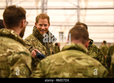 The Duke of Sussex talks to service personnel during a visit to Exercise Clockwork in Bardufoss, Norway, for a celebration of the 50th anniversary of the Commando Helicopter Force and Joint Helicopter Command deploying for extreme cold weather training. Stock Photo