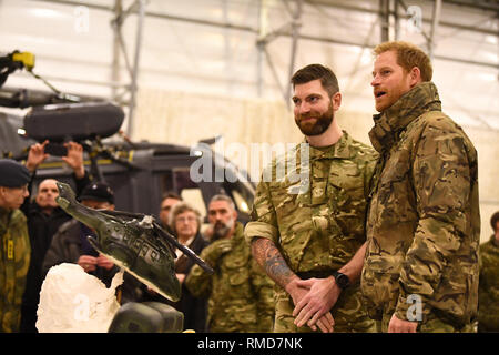 The Duke of Sussex (right) talks to service personnel during a visit to Exercise Clockwork in Bardufoss, Norway, for a celebration of the 50th anniversary of the Commando Helicopter Force and Joint Helicopter Command deploying for extreme cold weather training. Stock Photo