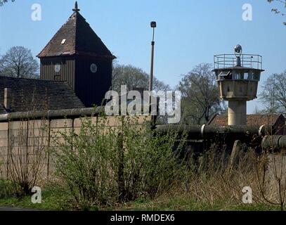 View over the Wall in Berlin to East, where one can see a church and a DDR- watchtower. Stock Photo