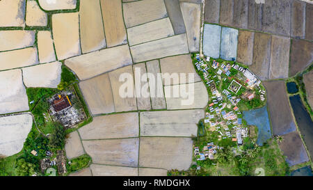 Temple and cemetery in looded rice fields near Hoi An, Vietnam Stock Photo