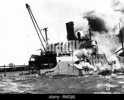 The sinking ship 'Houston', which had been bombed by Castro's aircrafts, and caught fire. Most of the Cuban exiles, who were on board the transport ship, drowned in the sea. Stock Photo