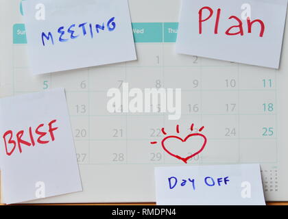 paper note for vacation remind stick on calendar Stock Photo