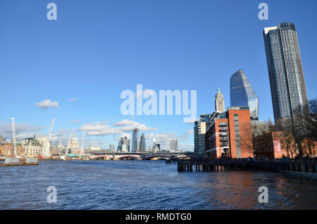A view of the river Thames looking east from Southbank. The OXO tower is to the right with the City of London skyline in the distance Stock Photo