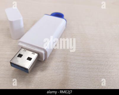 USB stick with wooden background Stock Photo