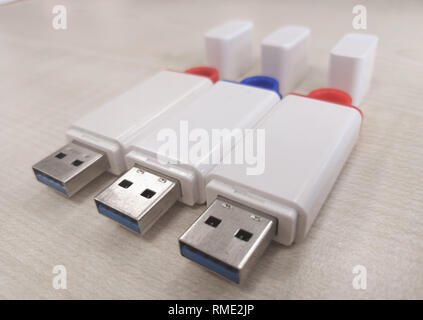 USB stick with wooden background Stock Photo