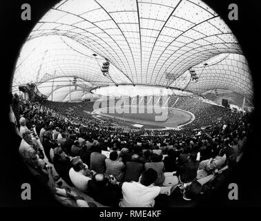 View from the corner grandstand / south curve in the Munich Olympic Stadium on a football game during the Football World Cup 1974. Stock Photo