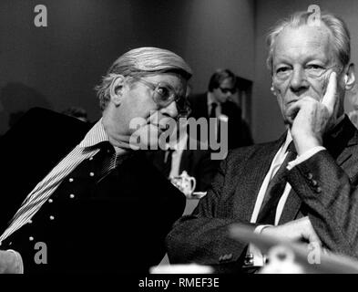 Former Federal Chancellor Helmut Schmidt leans to Willy Brandt, party leader of the SPD. Stock Photo