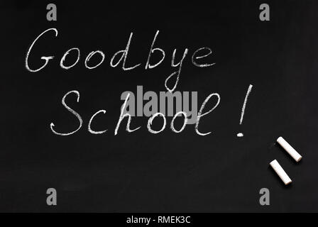 School is goodbye. Blackboard and chalk. End of the school year. High school graduation. Stock Photo