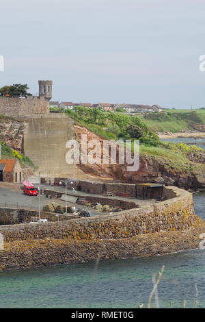 Crail Castle and Crail Harbour Wall at High Tide on a Summers Day. Fife, Scotland, UK. Stock Photo