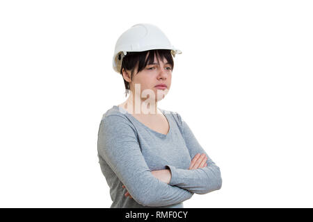 Upset woman engineer wearing protective hardhat isolated over white background. Stock Photo
