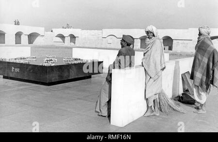 Visitors at the tomb of Mahatma Gandhi. The tomb, called Raj Ghat, is a cenotaph, since Gandhi's ashes were scattered in the Ganges and other waters. (undated photo) Stock Photo