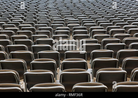 Many rows of seats in a large hall Stock Photo