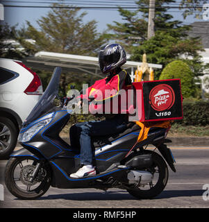 Chiangmai, Thailand - February 4 2019: Delivery service man ride a Motercycle of Pizza Hut Company. On road no.1001, 8 km from Chiangmai city. Stock Photo