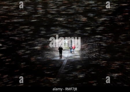 Walking in a dark tunnel, Germany Stock Photo