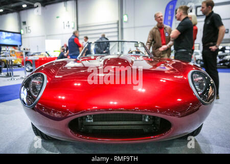ExCel, London, UK, 14th Feb 2019. An Evolution E-Type is much admired. he London Classic Car Show 2019 opens at ExCel Exhibition Centre in London Docklands. The show  brings together classic car owners, collectors, experts and enthusiast with dealers, manufacturers and car clubs in a celebration of motoring and classic cars. Credit: Imageplotter News and Sports/Alamy Live News Stock Photo