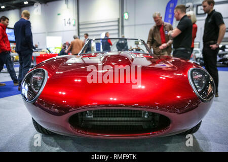ExCel, London, UK, 14th Feb 2019. An Evolution E-Type is much admired. he London Classic Car Show 2019 opens at ExCel Exhibition Centre in London Docklands. The show  brings together classic car owners, collectors, experts and enthusiast with dealers, manufacturers and car clubs in a celebration of motoring and classic cars. Credit: Imageplotter News and Sports/Alamy Live News Stock Photo