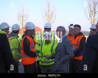 Bletchingdon, Oxfordshire, UK. 15th Feb 2019. Prince Charles the Prince of Wales meets dignitaries, workers and residents during a visit to a housing development in Bletchingdon, part of the Duchy of Cornwall’s Eastern District. He also visited Bletchingdon Parochial Church of England School and Bletchingdon Village Hall. Credit: Angela Swann/Alamy Live News Stock Photo