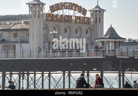 Brighton, UK. 15th Feb, 2019. Visitors enjoy the warm sunny weather on Brighton beach today as the forecast is for more of the same over the weekend Credit: Simon Dack/Alamy Live News Stock Photo