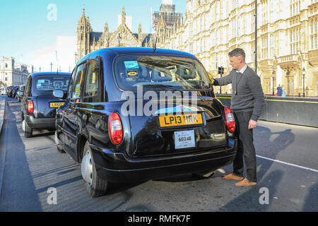 London, UK. 15th Feb 2019. Black cab drivers once again bring parts of central London to a standstill and block roads around Parliament Square and Westminster with their ongoing protest against plans to ban them from driving on roads in parts of the capital. Credit: Imageplotter News and Sports/Alamy Live News Stock Photo