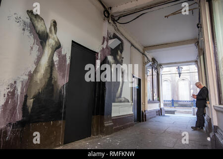 Glasgow, Scotland, UK. 15th February, 2019. The Woman in Black Mural on Royal Exchange Square by artist James Klinge. Credit: Skully/Alamy Live News Stock Photo