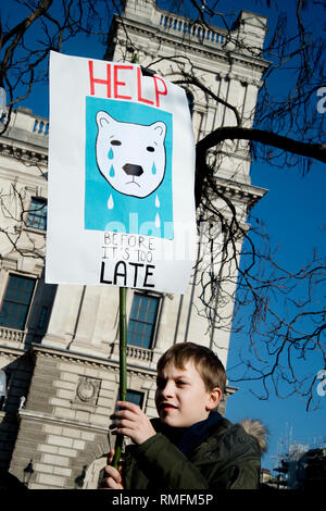 London, UK. 15th Feb, 2019. Thousands of schoolchildren and young people in the UK have taken part in climate strikes, walking out of school to protest at government inaction on climate change as part of a global campaign for action on climate change.The school strikes have been inspired by young Swedish activist Greta Thurnberg who since August 2018 has been protesting on Fridays. In London several thousands children and students gathered in Parliament Square, Westminster. A young bear holds a drawing of a crying bear. Credit: Jenny Matthews/Alamy Live News Stock Photo