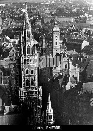 View from the Frauenkirche (Cathedral of Our Blessed Lady) from left to right at the Neue Rathaus (New Town Hall) and Alte Rathaus (Old Town Hall) and the Heilig-Geist-Kirche in Munich. Stock Photo