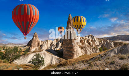 Pictures & images of hot air balloons over the fairy chimney pillar rock formations  near Goreme, Cappadocia, Nevsehir, Turkey Stock Photo
