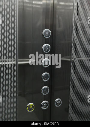 Interior and closeup of metal buttons in elevator. Stock Photo