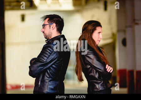 Couple in love angry after an argument, with their backs to each other. Stock Photo