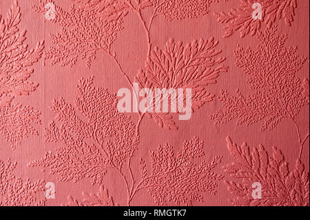 Textured wallpaper showing the texture and pattern in red Stock Photo